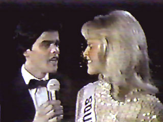 Donny Osmond serenades Miss Universe 1980, Shawn Weatherly of South Carolina during the 1980 Miss USA pageant